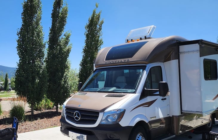 Side windows and skylight dark tinted to reduce heat.