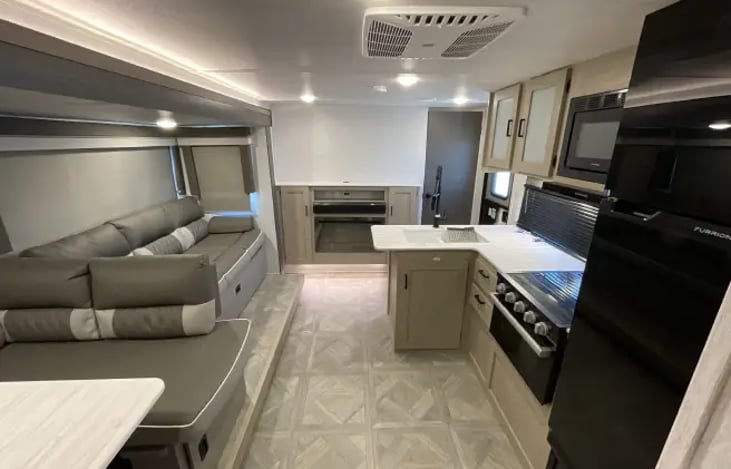 living area, kitchen, dining space from bunk house room view. 

working gas fireplace as well as TV Hookup/Bluetooth speaker.