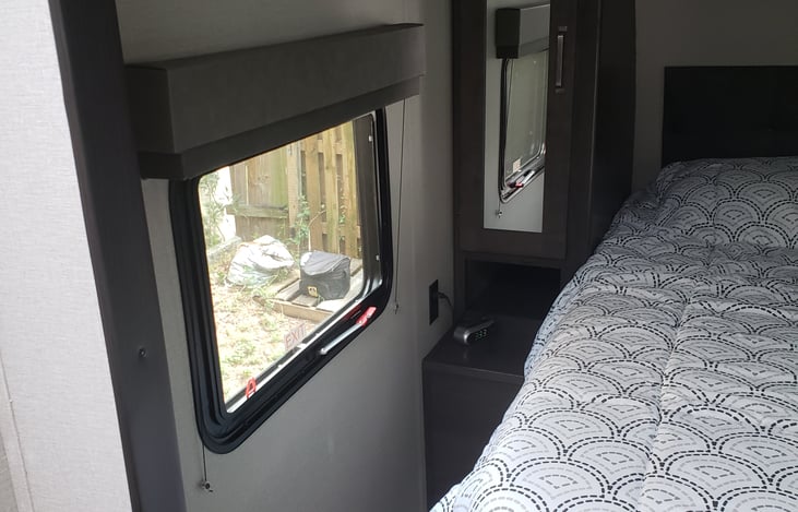 Bedroom with large window.