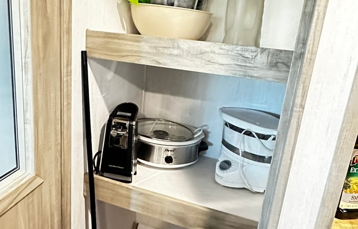 Walk in pantry (or so they call it!) offers even more kitchen aides.