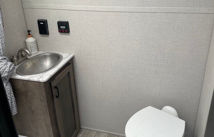 Shower stall, sink and toilet.