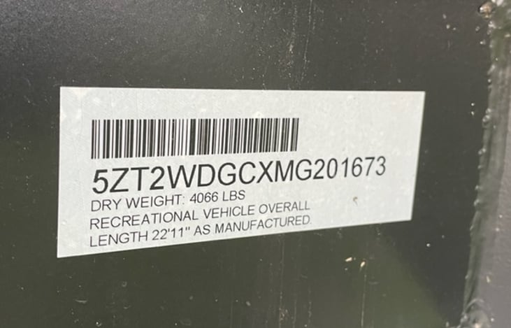 VIN number and dry weight of the camper of 4,066 lbs. This is the weight with all tanks empty as the camper rolled out of the factory prior to delivery to our family.