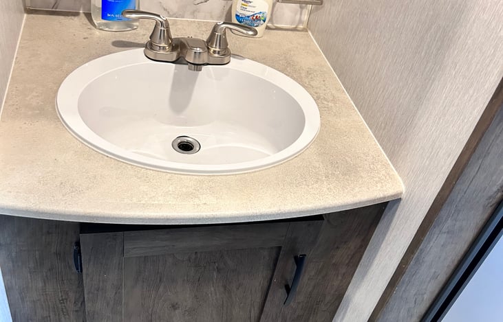 Bathroom sink in hallway separate from toilet