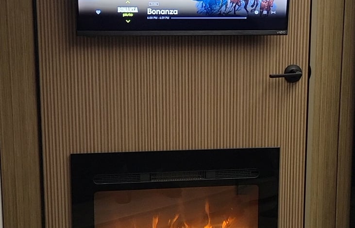 Large hidden pantry, T.V. and fireplace