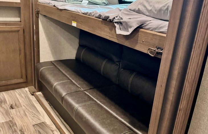 Fold up top bunk and pull out couch on bottom