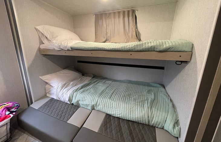 Bunk house includes three bunk beds. The lower bunk converts into a queen.