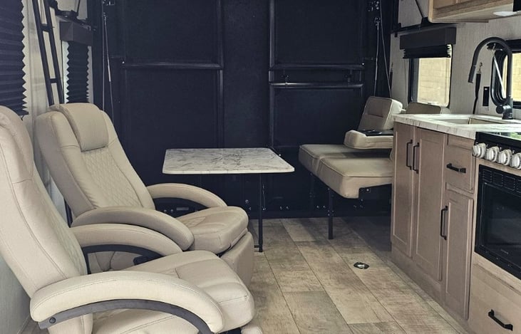 Spacious living area with comfortable reclining chairs