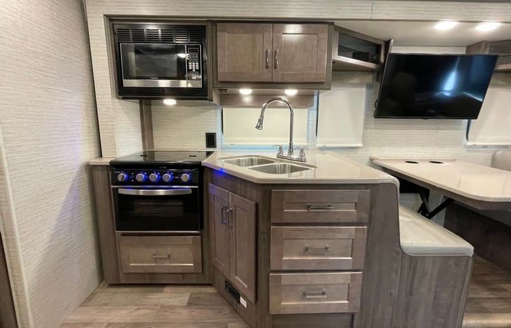 Versatile kitchen space with dining table for food and games.