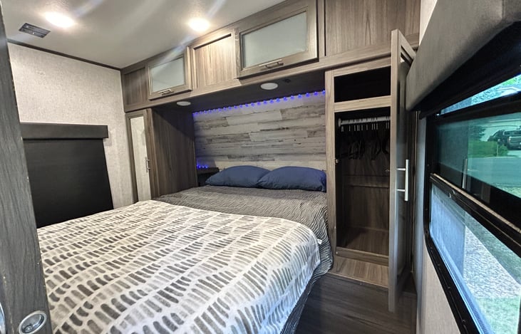 Primary bedroom with double closets and tons of storage above and under bed