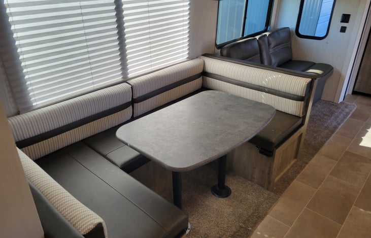 U shaped Dinning area and Couch, both fold out into beds.