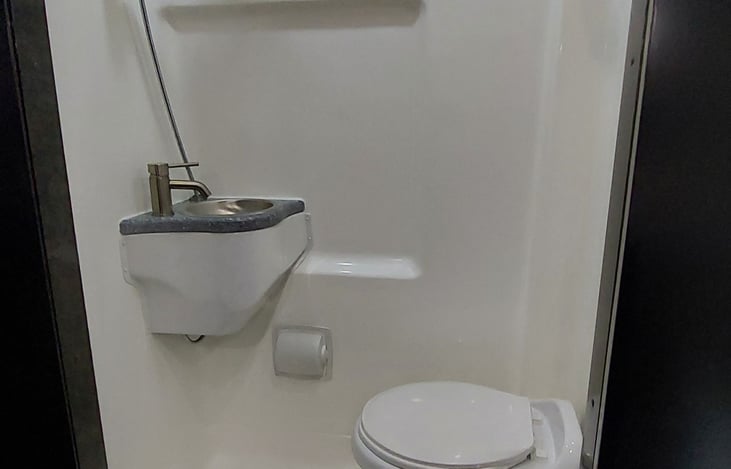 The bathroom is expectedly small but suprisingly functional, especially for "calls" in the middle of the night. Complete with hot shower too!