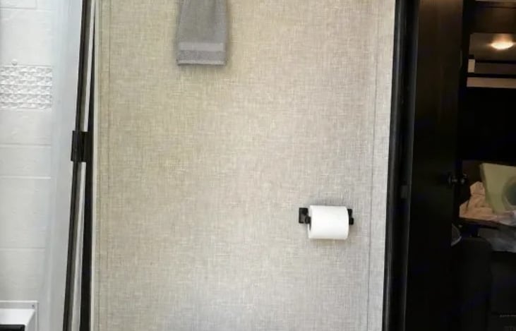 A direct exterior door allows guests to use the restroom directly from the campsite, keeping the main living area quiet and clean.