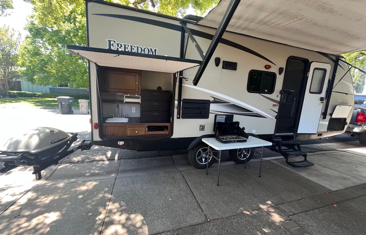 Includes WeberQ, propane stove & stowable table