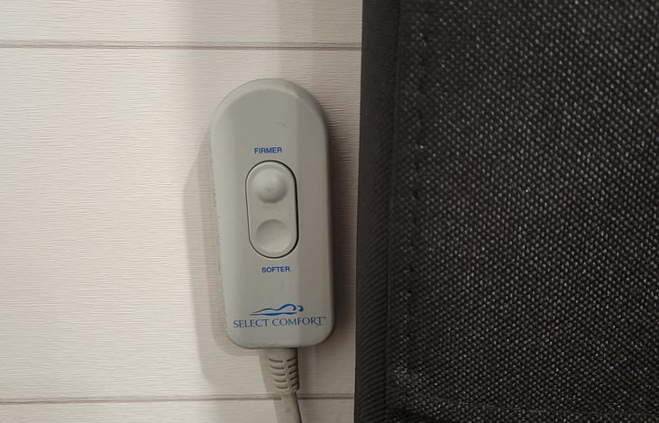 Mattress firmness controls on both sides of soft headboard we added.