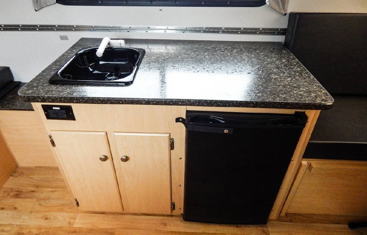 Sink + fridge (and storage). (stock photo)