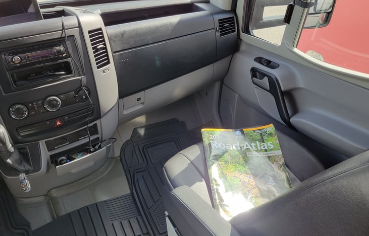Luxury leatherette seats, floor mats and an Atlas just in case.