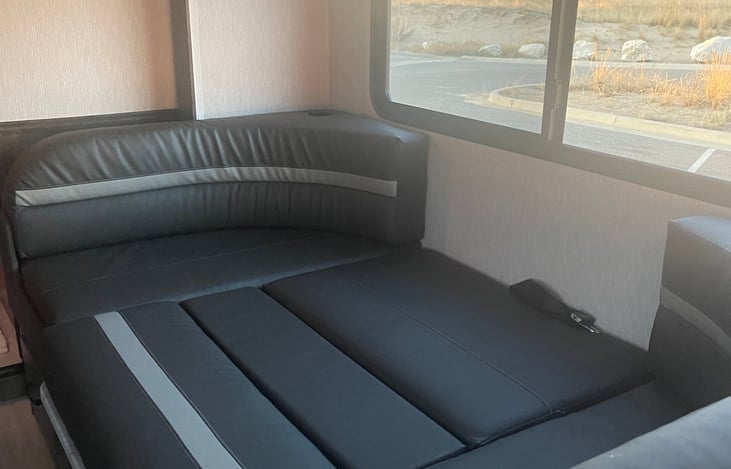 Dinette converted to full sized equivalent bed. Memory foam topper included for additional comfort.