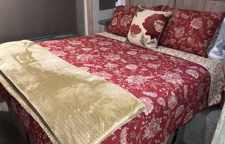 Queen bed comes with extra pillows if desired, or use your own and extra blankets. Memory foam mattress.