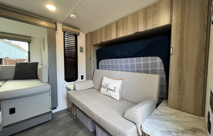 Couch seating with Murphy bed stowed behind