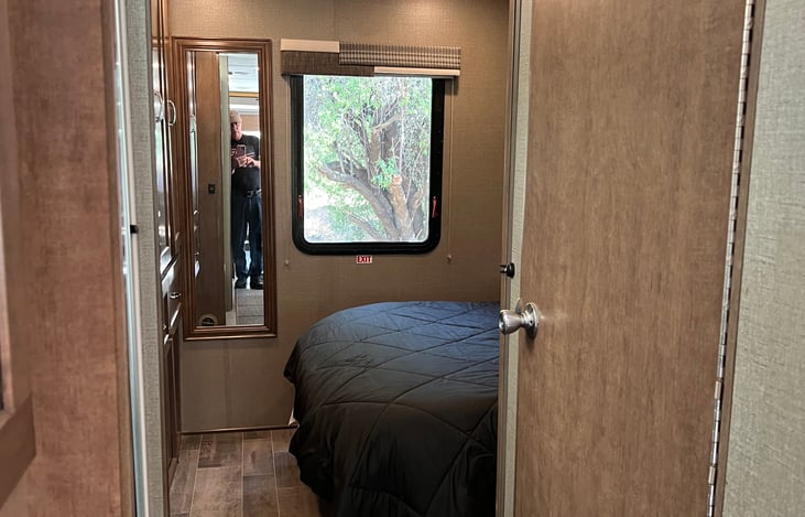 Looking into the bedroom, fully opened out.