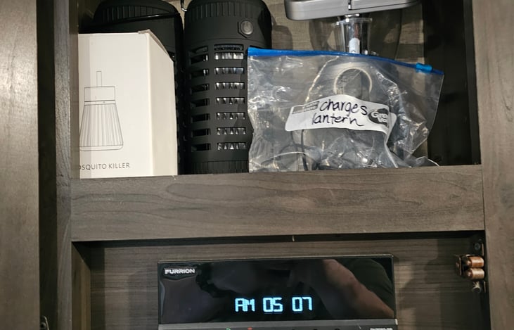 Radio with interior and exterior speakers. 2 bug lanterns and an emergency wind up lantern included for your convenience.