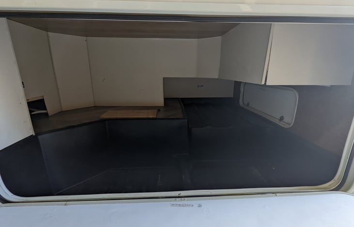 HUGE under bedroom storage area.