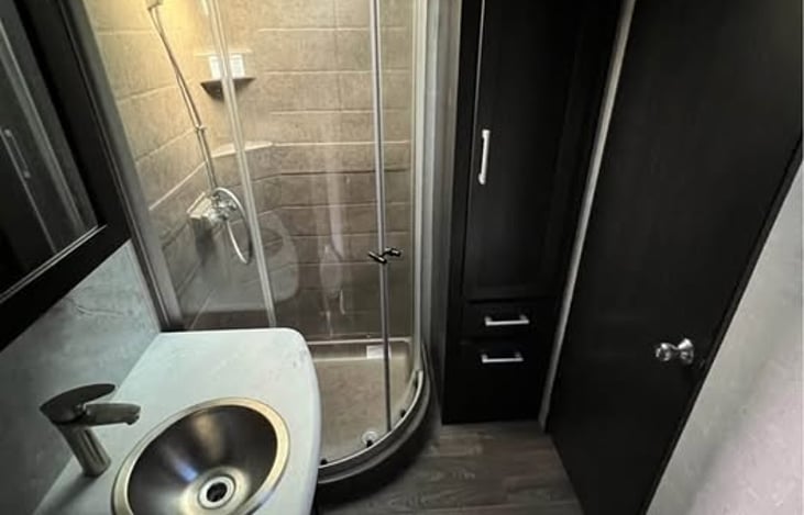 Spacious Bathroom with Storage Cabinets