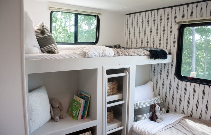 Fuel young imaginations in the camper bunkroom, where books await to inspire endless adventures.