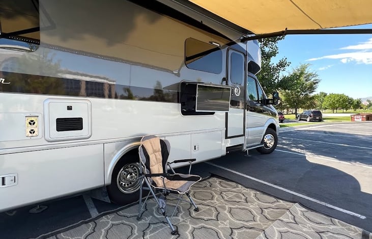 Large electric extending awning with built in lights and television for a relaxing evening