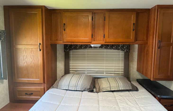 large cabinet and storage space in back bedroom