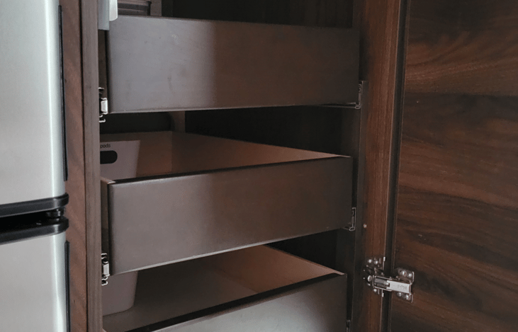 Pull out drawers in pantry provide ease of access.