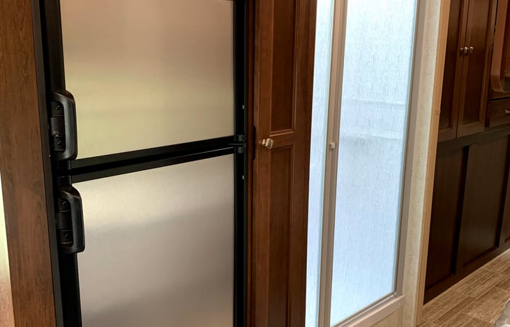 The refrigerator and freezer run on electricity or propane.