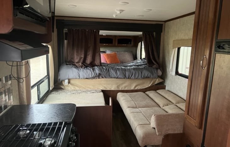 Couch and dinette fold down into beds.