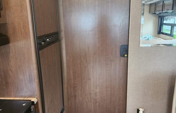 Sliding door for extra privacy and shower/bathroom space.