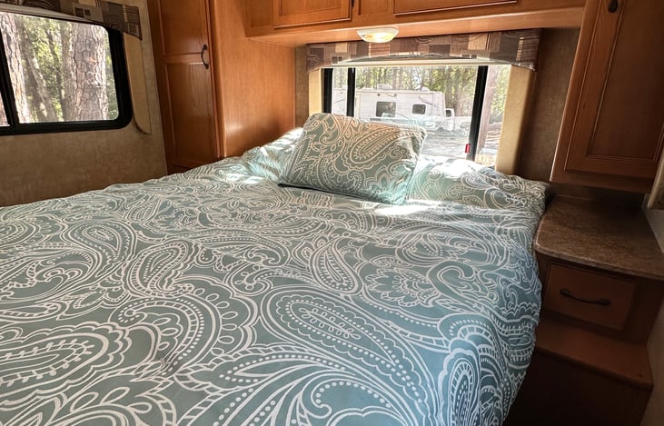 Lots of storage with two hang-up closets on either side of the bed and over-bed storage with two night stands and drawers.