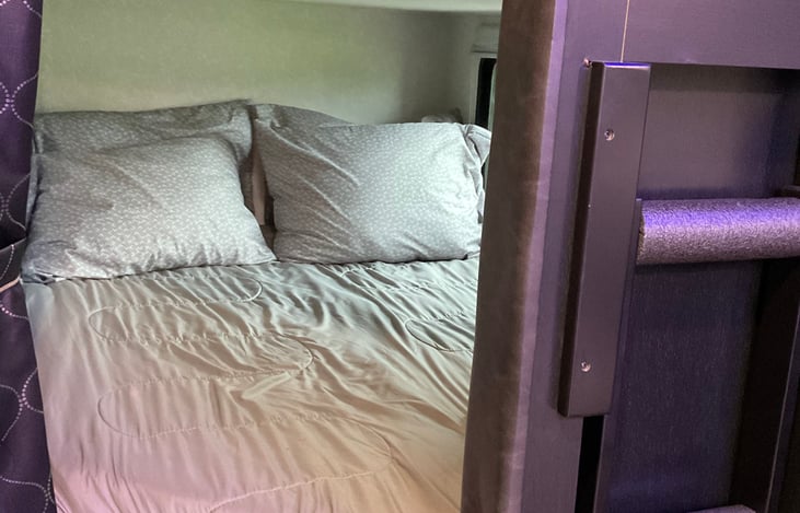 Bottom bunk with gel-infused foam mattress topper. Ladder steps to top bunk has foam rollers for comfort to protect little barefeet while climbing up to the top bunk.