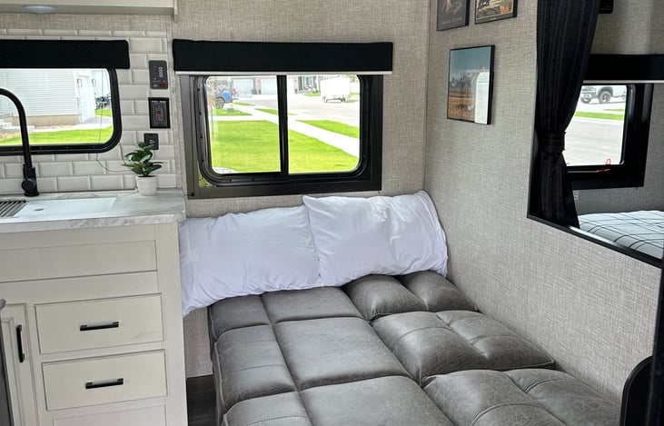 Couch bed can sleep one adult or two children.