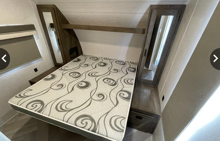 Master bedroom with closets on each side for your storage convenience. The bed also raises for easy access to more storage.