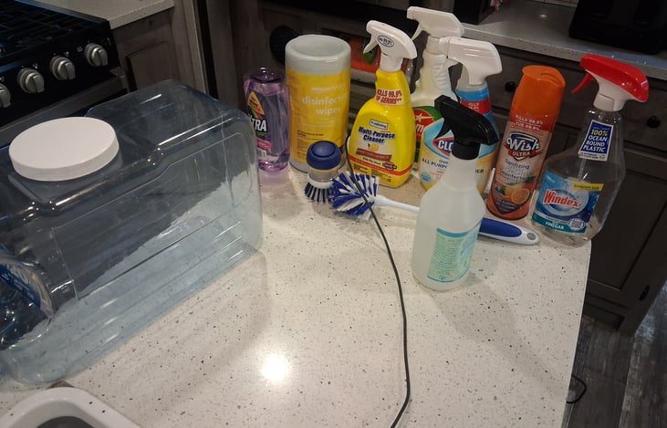 Fresh water dispenser jug.and the cleaning products with the camper.