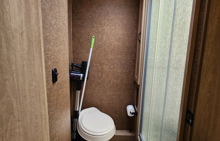 Toilet and shower with door for privacy
