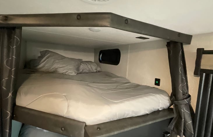 Top bunk with 2” Gel-infused memory foam mattress topper. 150 lb. limit on top bunk.