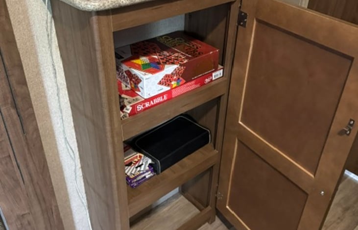 Game cupboard, we have chess, checkers, farkle, uno, scrabble and cards