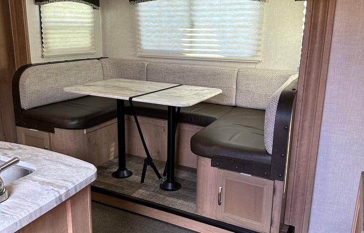 Slide out is a table that converts to a bed for 2