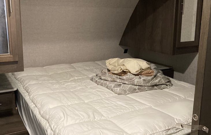 Queen bed with 4 inch memory foam mattress topper.