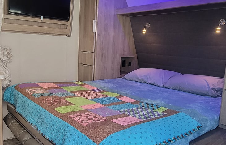 Comfortable bed with reading lights, mood light, privacy curtain, electronic charging ports, plenty for all of your devices! Also, a smart tv on a hinge so everyone can enjoy, or just you!