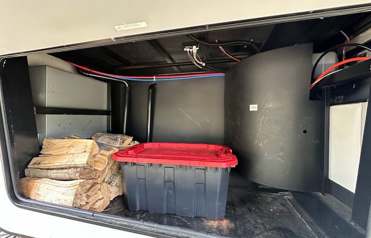 Forward undercarriage storage area.