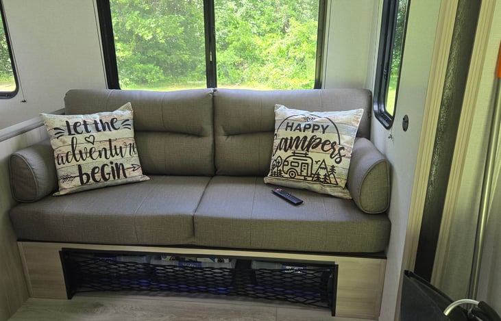 Comfortable couch, can fold into a bed if space is needed (sheets not included).