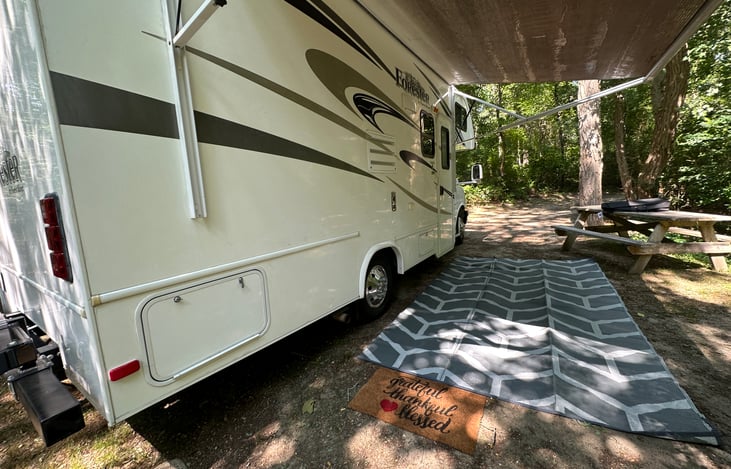 Right side of the rig with included oversize outdoor carpet.