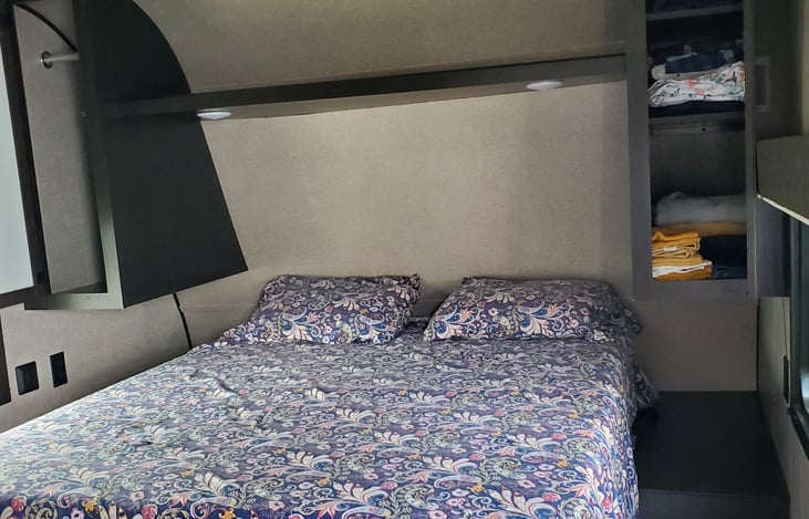 Queen bed with storage on both sides and underneath bed