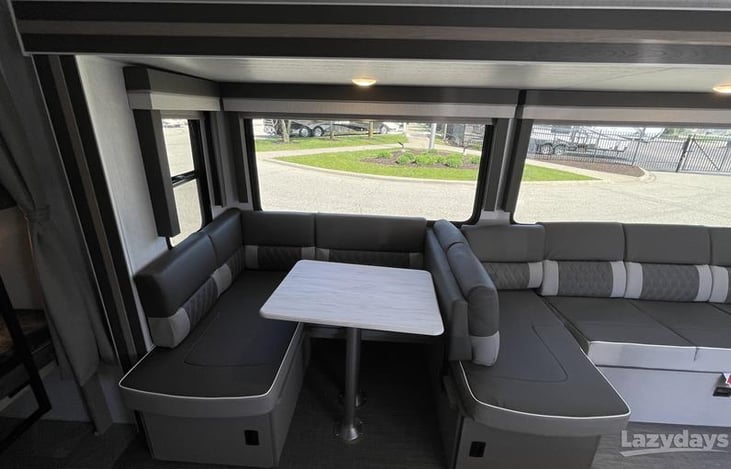 Dining room that can be pulled out to make a bed.  (middle backrest can be moved to other side to create more seating.)